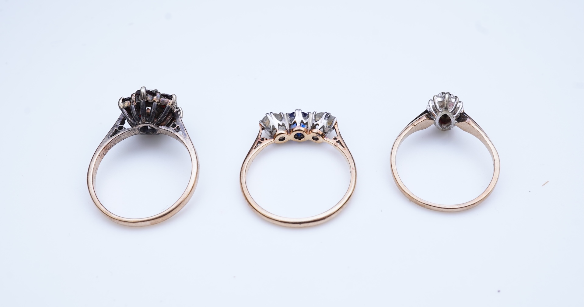 A group of three rings and a tie pin
